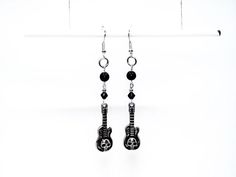 The Grunge Anthem Earrings 💀 Unleash your inner rockstar with these bold and edgy earrings that are perfect for headbanging babes and music lovers alike. 💀 Amp Up Your Look: A mix of black and silver beads: Creating a dark and mysterious vibe that reflects your alternative spirit. Fierce guitar charms with skull detailing: The ultimate symbol of rock and roll rebellion, adding a touch of gothic glam 💀 Only one available as I like to make one of a kind pieces so that you have a unique, standou Guitar Earrings, Gothic Glam, Edgy Earrings, Black And Silver, Music Lovers, Favorite Things Gift, Silver Beads, Beaded Earrings, Rock And Roll