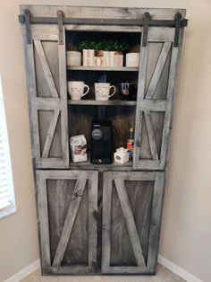 an old barn door is used as a entertainment center