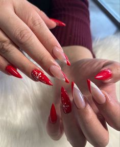 Red French With Rhinestones, Red Snowflakes Nails, Red Nails With White Snowflakes, Holiday Almond Nails Winter, Red Nails Snowflake, Red Nails With Snowflakes, Red Christmas Almond Nails, Bright Red Christmas Nails, Red Nails With Snowflake Design