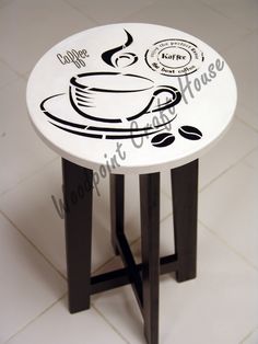 a white table with coffee designs on it