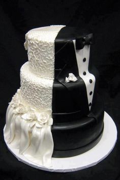 two tiered wedding cake with black and white decorations