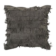 a gray pillow with fringes on it