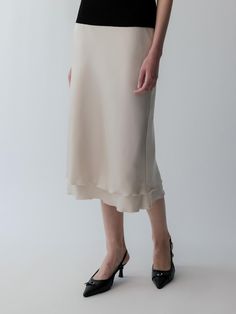 Composition : POLY 100Color : cream beige, blackCountry of Origin : KOREA Flowy Silk Skirt In Beige, Flowy Silk Beige Skirt, Formal Long Cream Skirt, Beige Silk Relaxed Skirt, Chic Beige Silk Bottoms, Elegant Lined Cream Skirt, Beige Flared Evening Skirt, Elegant Cream Lined Skirt Bottoms, Fitted Silk Cream Bottoms