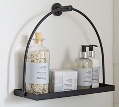 a shelf with soap, lotion and hand sanitizers on it