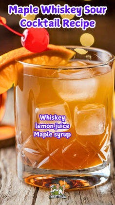 a glass filled with liquid next to an orange slice