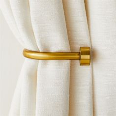 a curtain with a gold handle on it