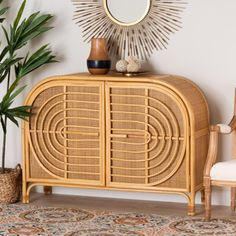 a wicker cabinet with a mirror on top and a chair in front of it