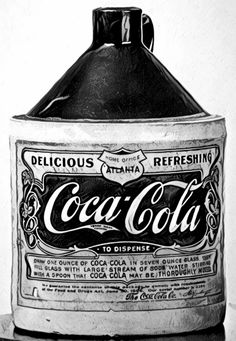 black and white photograph of an old coca - cola bottle