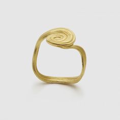 a gold ring that is shaped like a spiral