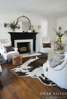 a living room filled with furniture and a fire place