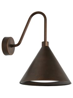 an old - fashioned wall light with a metal cone shade on the side and a white background