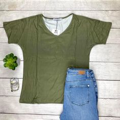 Get Ready To Fall In Love With The Fit And Fabric Of This Olive V-Neck Top. It Has A V Neck Line, Longer Short Sleeves, And A Slight Dolman Look. The Body Is A Relaxed Fit With Still Bringing That Feminine Look To It. This Will Sure To Be Your Newest Grab And Go Favorite! Fit: Runs True To Size With High Stretch. Material Is 95% Polyester And 5% Spandex Measurements: Chest 18.5” Body Length 25.6” Sleeve Length 10.6” Search Purposes Only: Casual Office Top Work Top Comfortable Trendy Fall Tops Wi Casual Solid Color V-neck Top For Summer, Spring V-neck Stretch T-shirt, Casual V-neck Tank Top For Spring, Everyday Stretch V-neck Top, Stretch V-neck Top For Everyday, Casual Stretch V-neck Tops, Trendy Green V-neck Top, Casual Solid Color V-neck Top For Spring, Casual Stretch V-neck Top For Summer