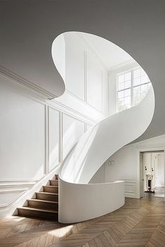 an image of a white staircase in the middle of a room