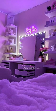 a bedroom with purple lighting and white fur on the bed is shown in this image