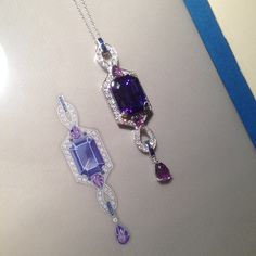 Emerald cut tanzanite and diamond pendant, finished off with carved amethyst leaves. A bespoke piece pictured next to its working drawing. Handmade Pearl Jewelry, Jewelry Sets Handmade, Jewelry Design Drawing, Jewelry Drawing, Jewellery Sketches