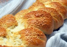 bread with sesame seeds on it sitting on a towel