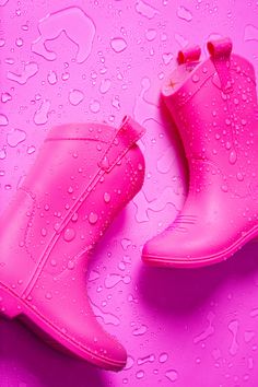 Time to kick up a little dust. Our atomic pink kid's all weather rubber cowboy boots are just as rugged and practical as the other colors, but we turned up the spice a bit. No laces, characters, or velcro…just a pink so hot it’s giving “free range” new meaning. No fences here, kids—hang on to your britches. Play Kitchen Accessories, Magnolia Baby, Sock Booties, Pink Cowgirl, Romper And Jacket, Bubble Romper, Boys Sneakers, Pink Kids, Girls Sneakers