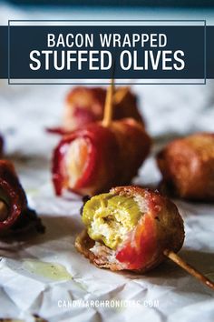 bacon wrapped stuffed olives on a table