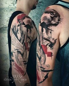 two men with tattoos on their arms, one has a lion and the other has a cross