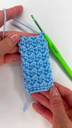 the crochet stitch is being worked on by two hands