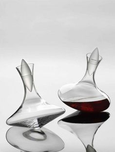 two wine glasses sitting next to each other