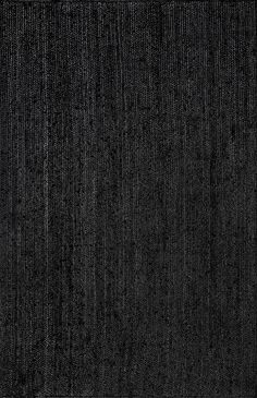 a black rug with vertical stripes on it