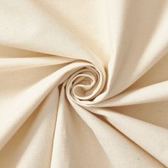 a close up view of the fabric in white with a spiral design on it's center