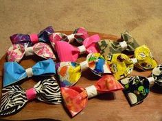 several different types of bow ties laid out on a table