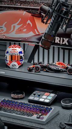 the red bull racing team's gear is on display at the race track museum