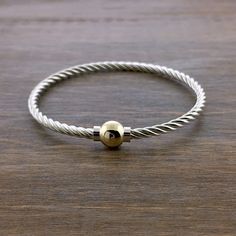 A nice "twist" on the traditional smooth Cape Cod bracelet! Features two separate silver pieces wound together for a unique look and added flexibility. Available in all sterling silver, two tone - sterling and solid 14k gold, or all 14k gold.  Please email to order all gold - special order and will take longer to ship Cape Cod Bracelet, Gold Thumb Rings, Hook Bracelet, Ball Bracelet, Jewelry Lookbook, Thumb Rings, Silver Pieces, Dream Jewelry, Cape Cod