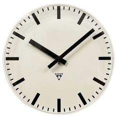 a white clock with black hands and numbers