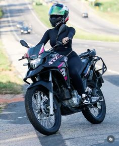 a person riding on the back of a motorcycle