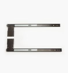 two metal shelf brackets on a white background