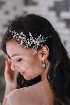 a woman wearing a bridal head piece