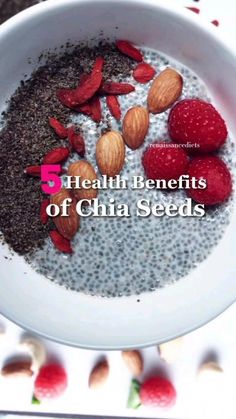 a white bowl filled with chia seeds and almonds on top of a table