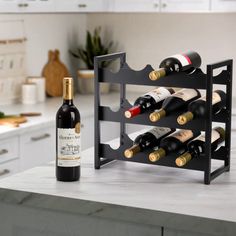 the wine rack is holding several bottles of wine