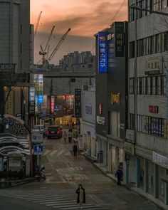 a city street filled with lots of tall buildings