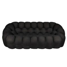 a black couch that is sitting on top of a white surface and it's made out of foam