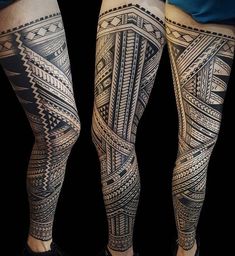 the legs are covered in black and grey ink with geometric designs on them, as well as an intricate design