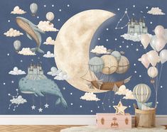 a wall mural with balloons, hot air balloons and a whale in the sky