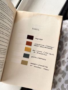 an open book with some different colors on it's pages and the title page is labeled babel