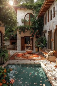 an outdoor swimming pool surrounded by greenery and potted plants on either side of the house