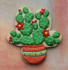 a cookie shaped like a cactus in a pot