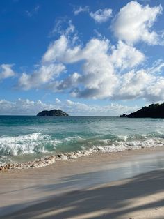 the beach has waves coming in to shore