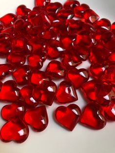 many red hearts on a white surface