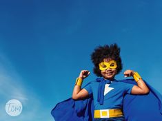 a young boy dressed as a super hero