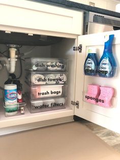 an open refrigerator filled with lots of cleaning products