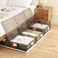 a bed with four drawers on the bottom and one drawer in the middle that is open