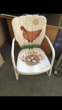 a white chair with a chicken painted on it