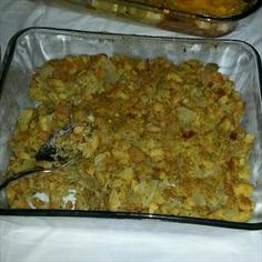 a glass casserole dish filled with potatoes and meat